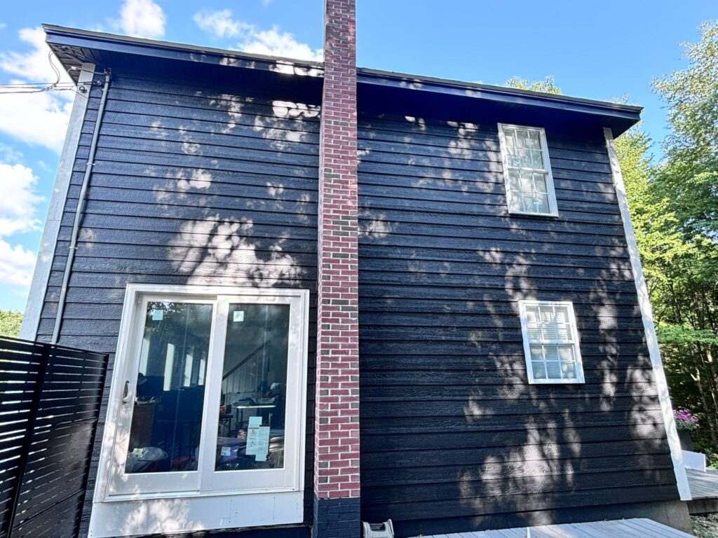 Premium dark siding replacement on an Andover home; our siding contractors don't require an upfront deposit—you only pay when the job is finished.